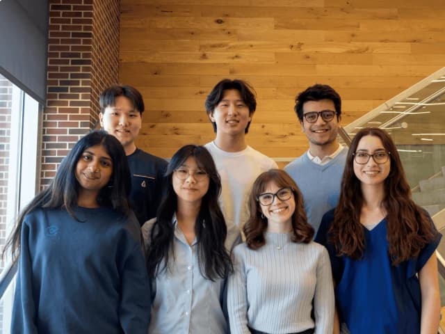 His Microsoft studio team together in a room